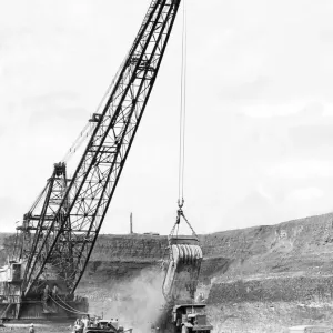 Twenty two tons of stone drops into a Euclid'carrier Twenty two tons of stone drops into a Euclid'carrier