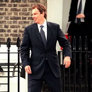 Tony Blair MP Labour Prime Minister with Alastair Campbell press officer leave home in