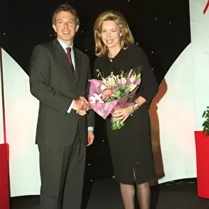 Tony Blair MP with Queen Noor of Jordan and bouqet May 1999 at The Mirror Pride of