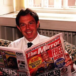 Tony Blair Prime Minister at Number 10 August 1997 reading a copy of The Mirror