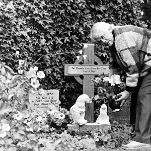 Tony Booth actor and writer father of Cherie Blair tending a shrine to wife