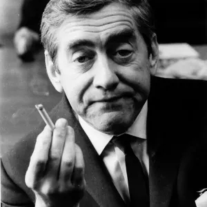 Tony Hancock holding up a lit cigarette August 1966 Tony Hancock holding up a lit cigarette August 1966