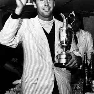 Tony Herne holding a glass of champagne and the British Golf Open trophy Tony Herne holding a glass of champagne and the British Golf Open trophy