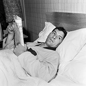 Tottenham and England footballer Alan Mullery lies flat out in bed at his Worcester Park