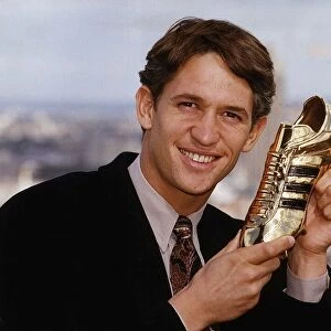 Tottenham Hostpur and England footballer Gary Lineker shows off the Golden Boot award he