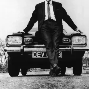 Black and white print of Jimmy Greaves in a car