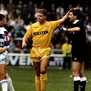 Tottenham Hotspur footballer Paul Gascoigne pats the referee on the head during a match