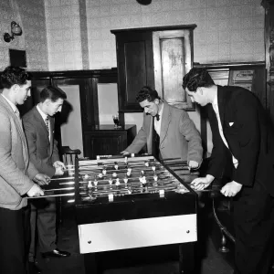 Tottenham Hotspur footballers enjoy a game of table football during a lunch time visit to