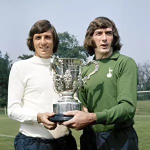 Tottenham Hotspur footballers Martin Peters (left) and pat Jennings shows off the League