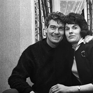 Tottenham Hotspur left back Ron Henry celebrates with his wife Edna at their home in