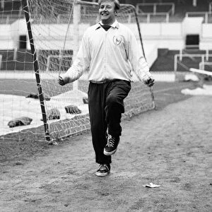Tottenham Hotspur winger Terry Medwin trains alone at White Hart Lane in a race for