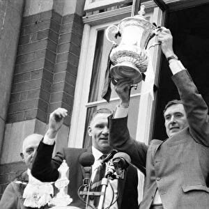 Tottenham Hotspurcaptain Danny Blanchflower watched by manager Bill Nicholson holds
