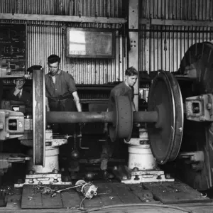 Trainees at a Royal Engineers Transportation training centre repair locomotive wheels in