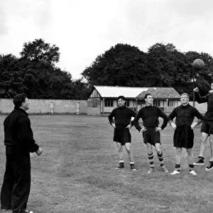 Trainer and coach Bob Paisley of Liverpool on the left putting some of the team member