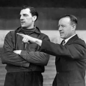 Trainer R. Liddell gives a word of advice to J. McCue the Stock City left-full-back Trainer R. Liddell gives a word of advice to J. McCue the Stock City left-full-back