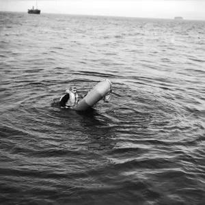 Training exercise for the Air Sea Rescue in the Solent. A downed fight pilot climbs Training exercise for the Air Sea Rescue in the Solent. A downed fight pilot climbs