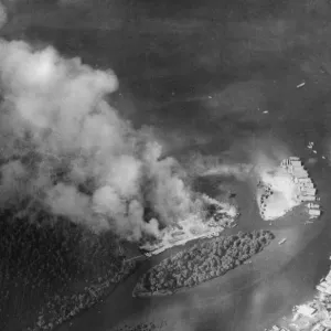 The trans-shipment base at Chumphon on the Kra Isthmus ablaze during a raid by RAF The trans-shipment base at Chumphon on the Kra Isthmus ablaze during a raid by RAF