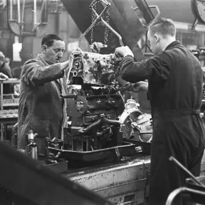 The transverse engine assembly line for the Mini. The Austin Mini production line The transverse engine assembly line for the Mini. The Austin Mini production line