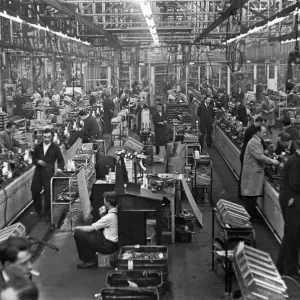 The transverse engine assembly line for the Mini. The Austin Mini production line The transverse engine assembly line for the Mini. The Austin Mini production line