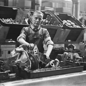 The transverse engine assembly line for the Mini. The Austin Mini production line The transverse engine assembly line for the Mini. The Austin Mini production line
