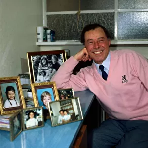 Bill Treacher with pictures of his family January 1987