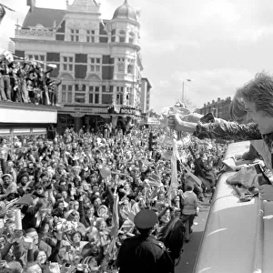 Triumphant West Ham players parade the FA cup trophy to their fans from an open top