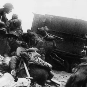 Troops of 3rd infantry division sheltering behind armoured vehicles on Queen Beach Troops of 3rd infantry division sheltering behind armoured vehicles on Queen Beach