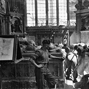 Troops clear bomb damage to St Michael Chapel at Canterbury Cathedral after it was