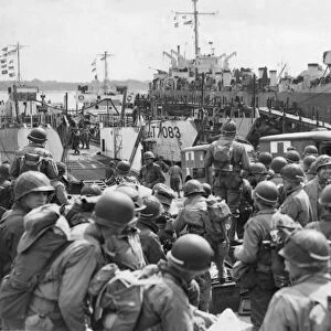 US Troops and supplies enroute to Normandy, June WW2. A scene at an
