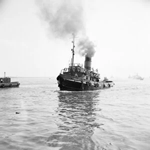 The Tug boat entering port. June 1952 C3046-002