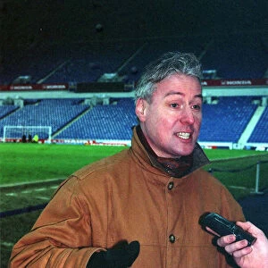TV Presenter Jim White at Ibrox Stadium being interviewed - February 1998