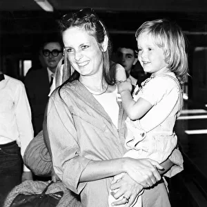 Twiggy model and actress leaving Heathrow airport for Los Angeles with daughter Carly who