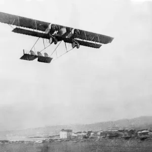A twin engined Caudron biplane in flight over Salonika in the Balkans during World War A twin engined Caudron biplane in flight over Salonika in the Balkans during World War