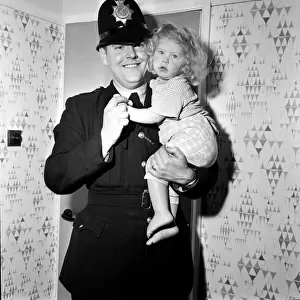 Two-year-old Deborah Almond, and PC Brian Corner, who rescued the toddler from a river