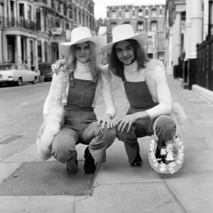 Unisex Wedding. Here come the bride and groom, dressed identically Unisex Wedding. Here come the bride and groom, dressed identically