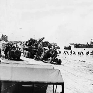 Unloading equipment on the beaches of Normandy on June 24th from various craft was in