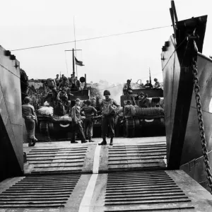 A U.s army loadmaster seen here directing load operations of American armour on to a A U.s army loadmaster seen here directing load operations of American armour on to a