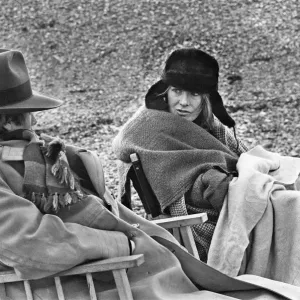 Vanessa Redgrave and James Fox sit in their cast chairs on the pebbled beach at Dover