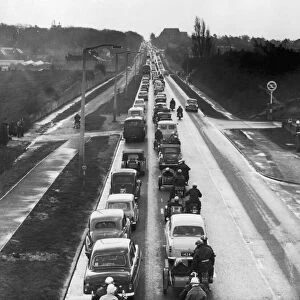 Vehicles queuing in a traffic jam near London. May 1965