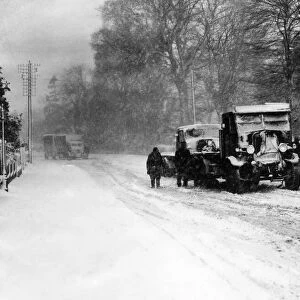 Vehicles become stuck in the thick snow in Rumney Hill, Cardiff after a heavy snowfall