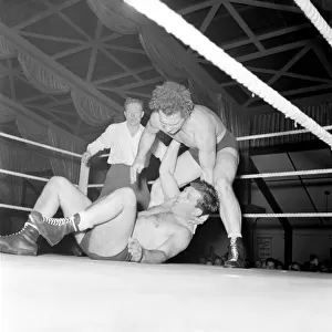 Vic Coleman vs. Cab Cash Ford at the town hall Wimbledon. May 1953 D5264-002