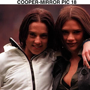 Victoria Adams and Mel C members of pop group the Spice Girls suddenly likes football as