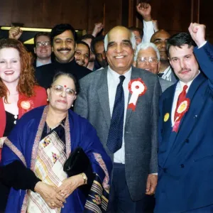 Victorious Labour Party candidates Parshotam Joshi and George Duggins celebrate their