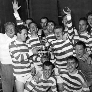 Victory celebrations for Celtic as they display the Scottish Cup they have just won by