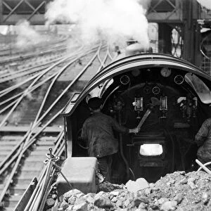 View over the cab of a Southern railways express train making its way from Waterloo to