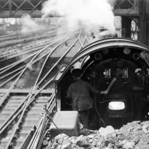 View over the cab of a Southern railways express train making its way from Waterloo to