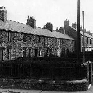 View of a street in Durham, showing a row of houses where miners live May 1936