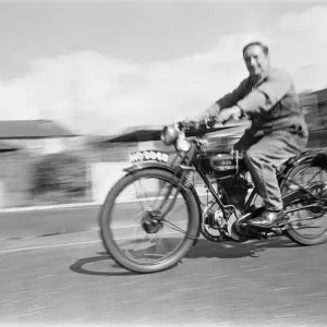 A vintage motorbike enthusiast out for a Sunday ride on his 1928 AJS Motorcycle A vintage motorbike enthusiast out for a Sunday ride on his 1928 AJS Motorcycle