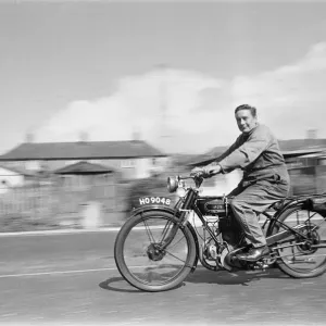 A vintage motorbike enthusiast out for a Sunday ride on his 1928 AJS Motorcycle A vintage motorbike enthusiast out for a Sunday ride on his 1928 AJS Motorcycle