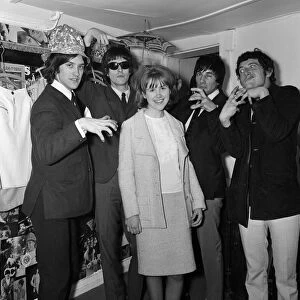 Virginia Campbell meets British rock group The Kinks at a dress shop in Kennington